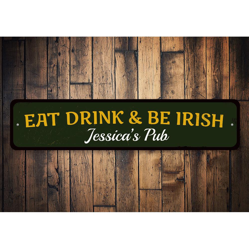 A decorative 'Eat Drink & Be Irish' metal sign, featuring vibrant colors and a charming design, perfect for home decor.