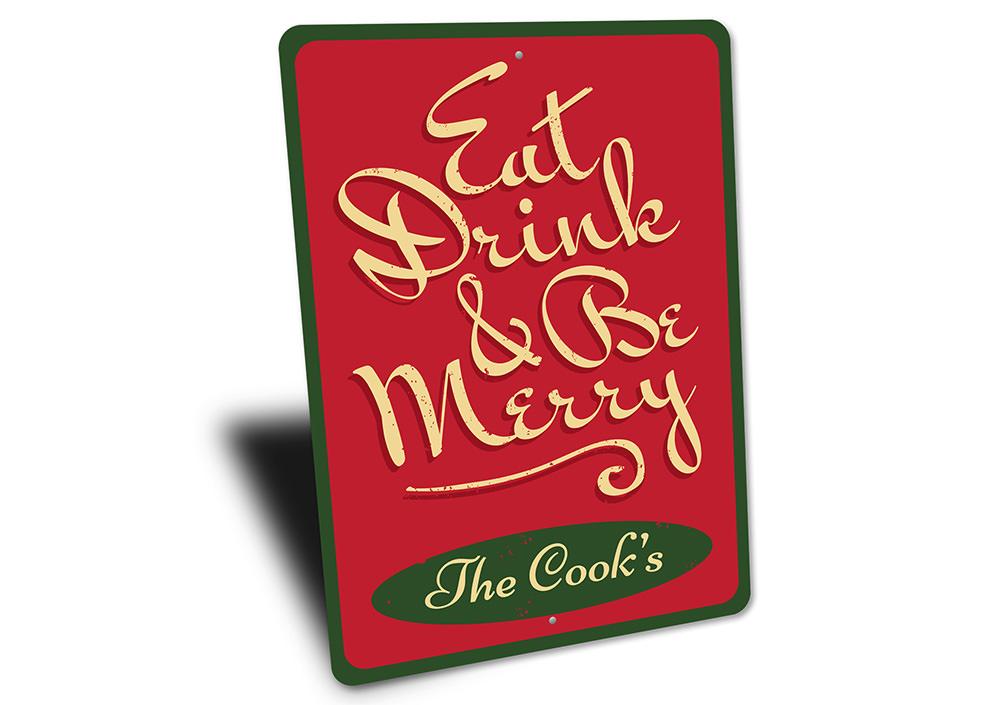 A festive Eat, Drink, & Be Merry Sign made of durable aluminum, featuring vibrant colors and a charming design, perfect for holiday decor.