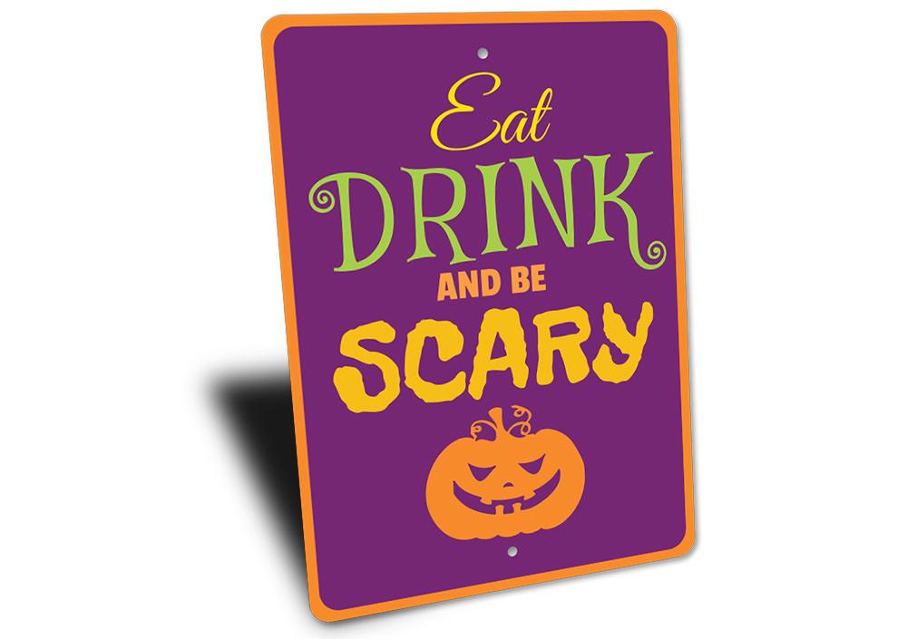 A decorative metal sign featuring the phrase 'Eat Drink Be Scary' designed for Halloween decor, showcasing spooky elements.