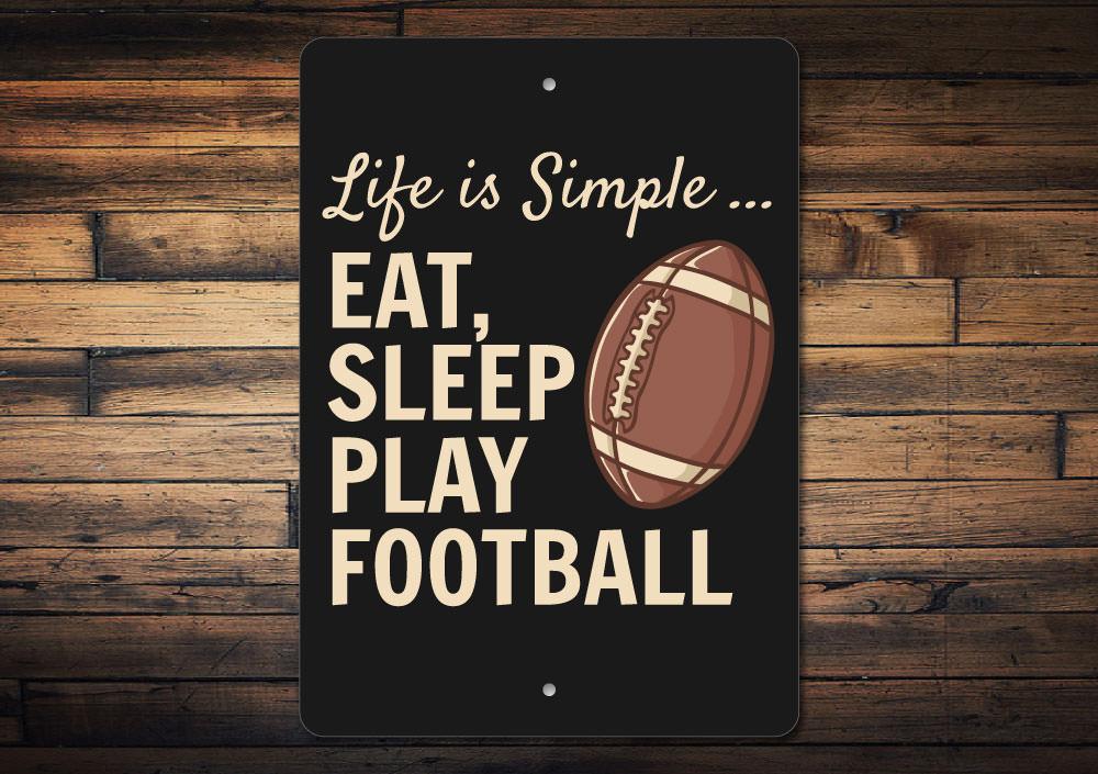 Eat Sleep Play Football Sign made of high-quality aluminum, featuring a football-themed design, perfect for decorating any sports enthusiast's room.