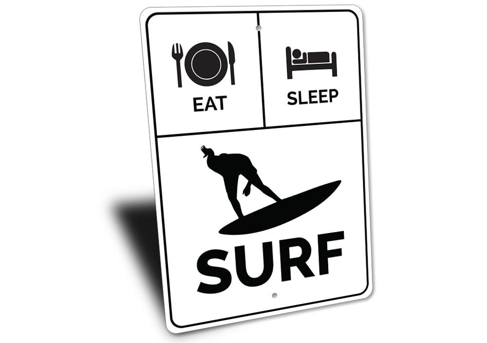 A decorative Eat Sleep Surf Sign made of high-quality aluminum, featuring vibrant colors and a beach-themed design, perfect for coastal decor.