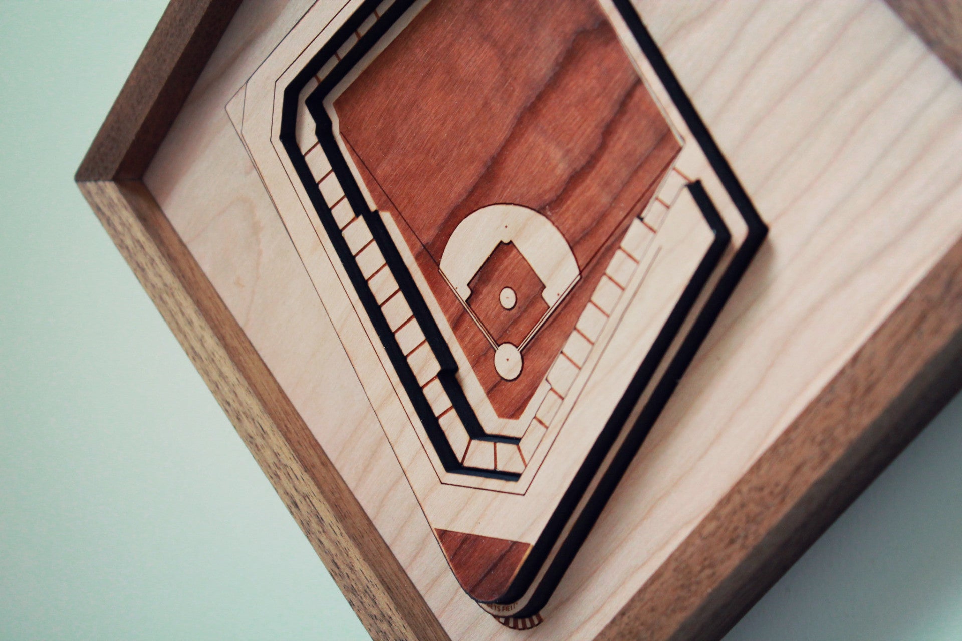 Ebbets Field replica showcasing intricate details and premium hardwood craftsmanship, framed in black walnut.