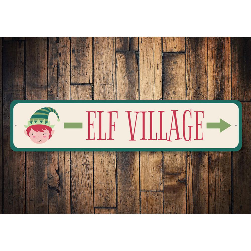 Elf Village This Way Holiday Sign made of aluminum, featuring festive design perfect for Christmas decorations.