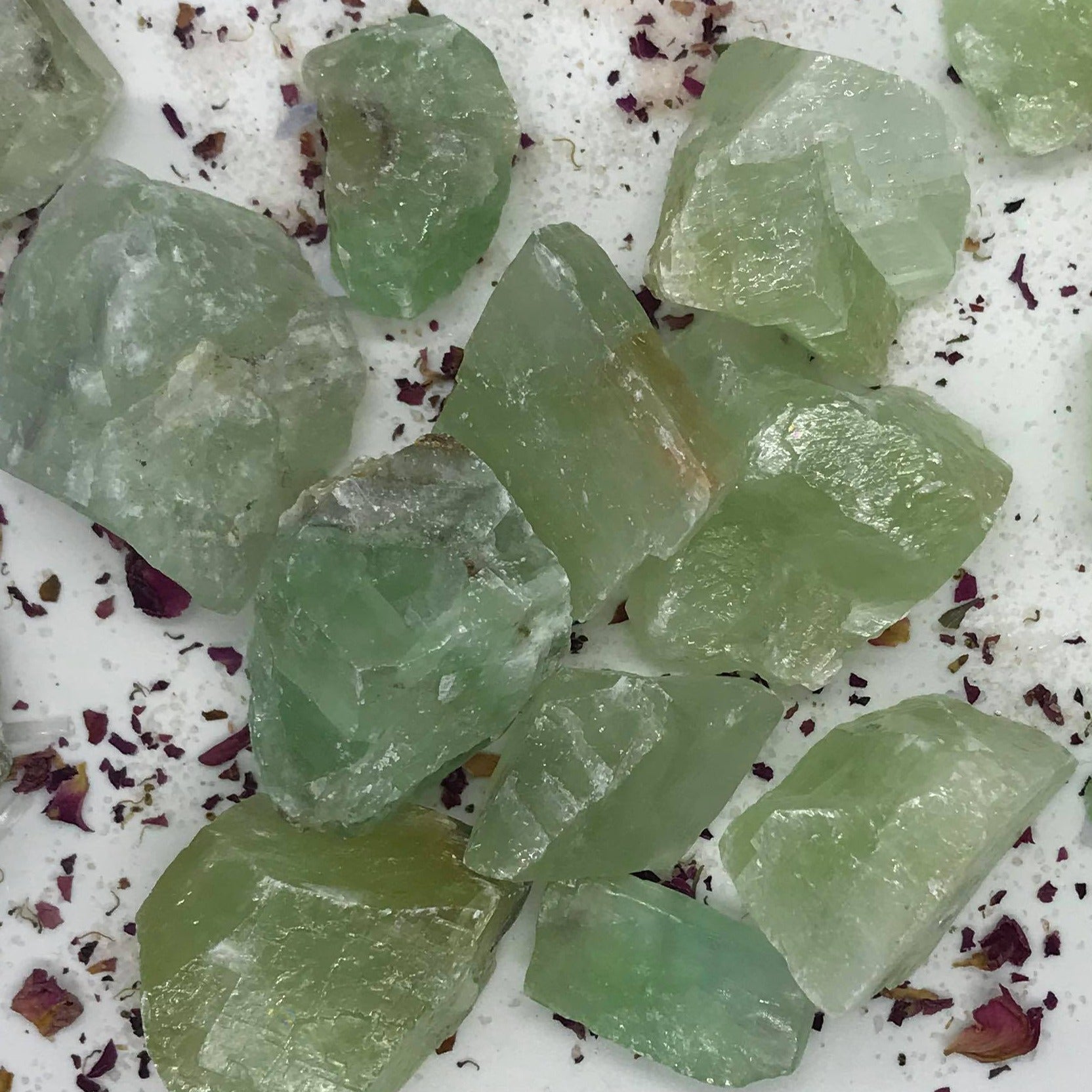 Emerald Calcite Crystal Chunks showcasing their unique green hues and natural textures, perfect for healing and meditation.