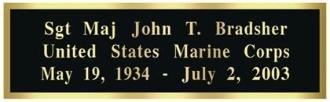 Engraved brass plate with black lettering, personalized for display cases, showcasing military honors or special messages.