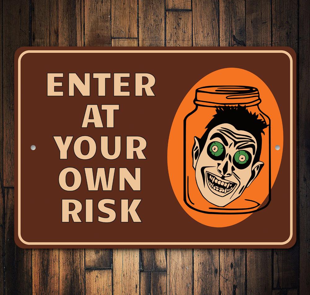 Enter at Your Own Risk Halloween Sign made of high-quality aluminum, featuring spooky design elements perfect for Halloween decor.