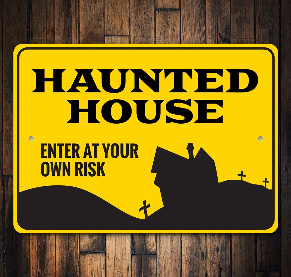 A spooky Enter Haunted House Sign made of durable aluminum, featuring eerie graphics perfect for Halloween decorations.