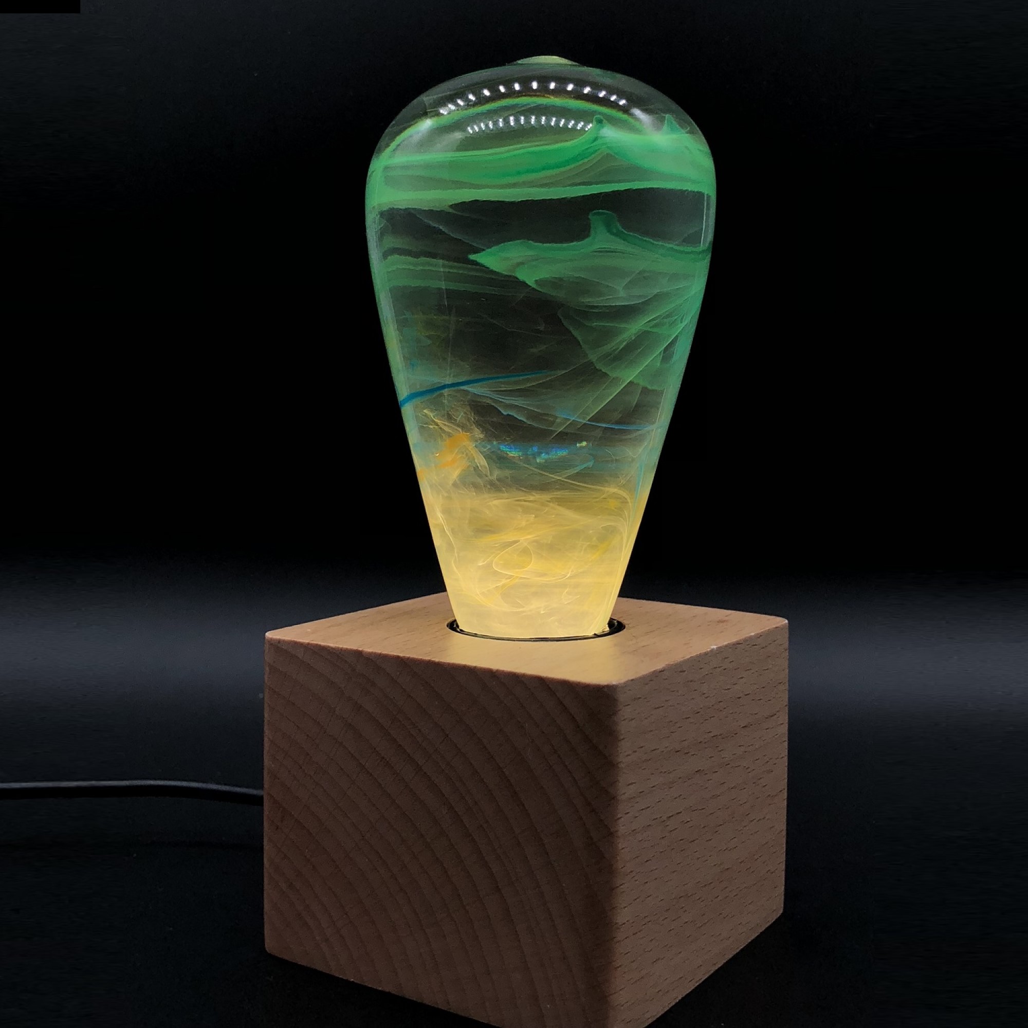 EP LIGHT - Alice LED bulb with eco-friendly resin construction and wooden base, showcasing its handcrafted design.