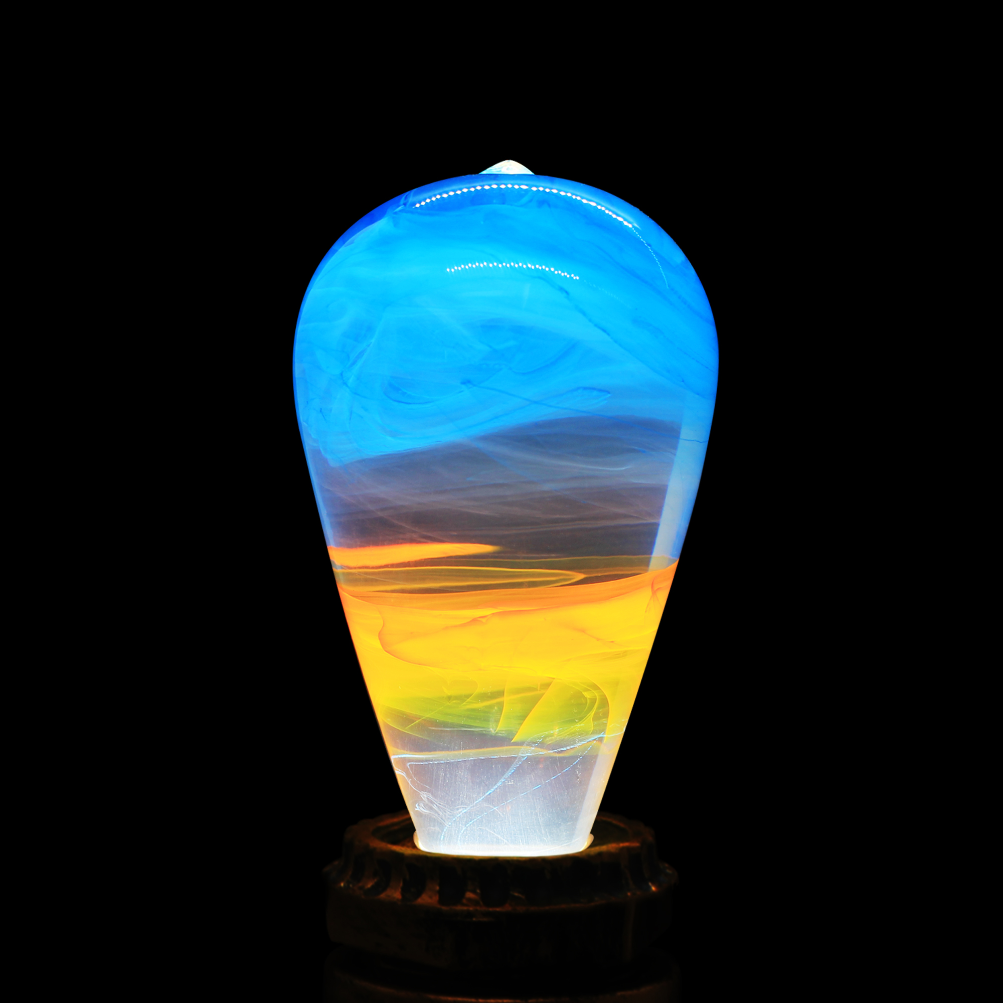 EP Light - Fire LED bulb with mixed colors and a handcrafted design, showcasing eco-friendly materials and a stylish beech wood base.