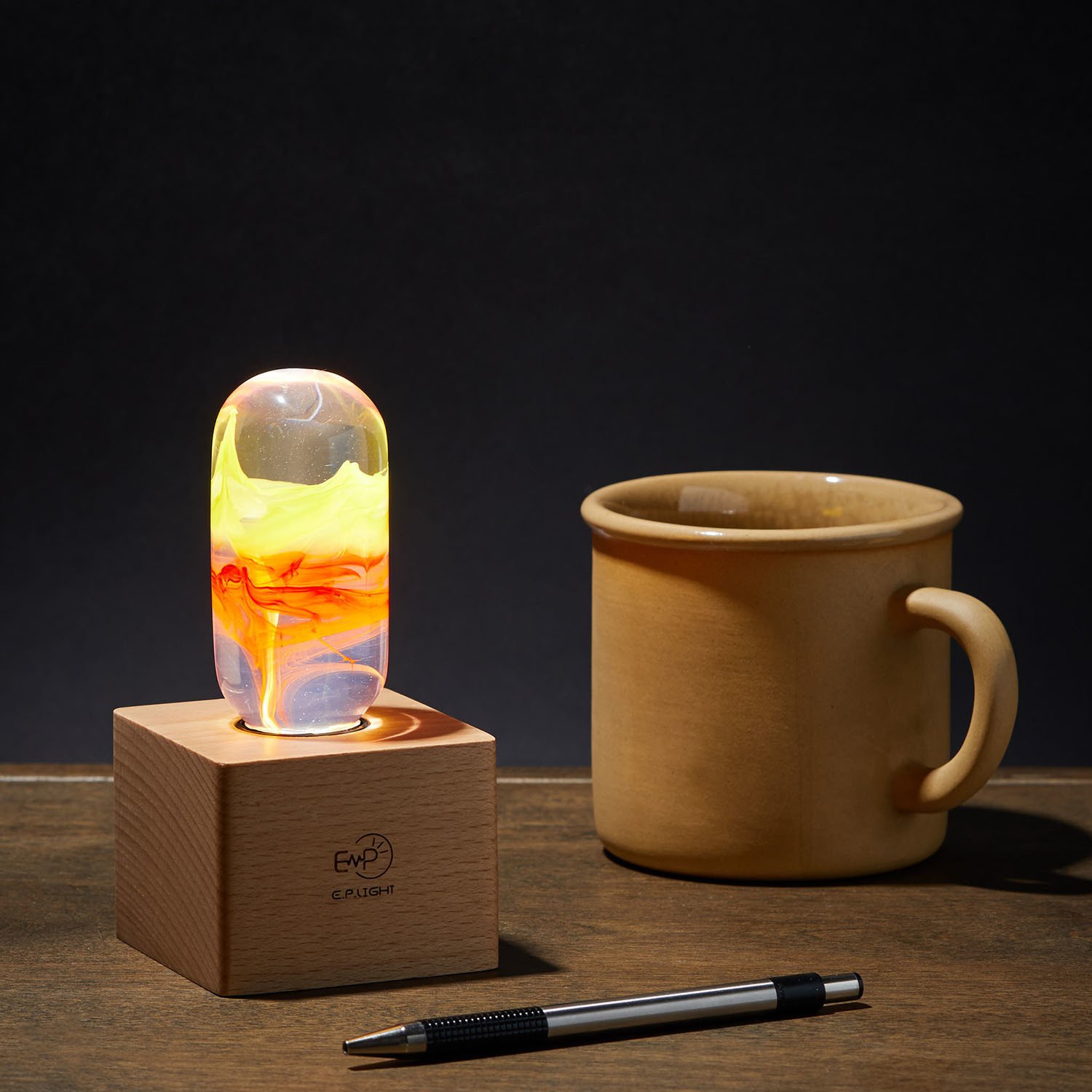 EP Light - Flame LED bulb with eco-friendly resin construction, showcasing its handcrafted design and stylish wooden base.