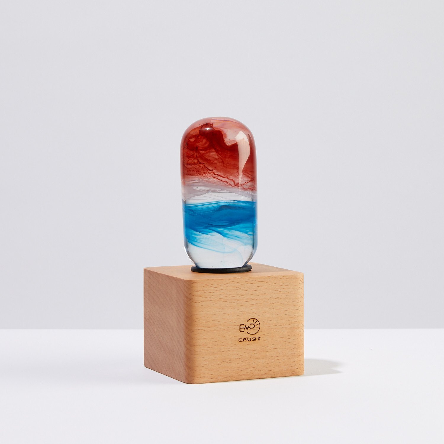 EP LIGHT - Sunrise handcrafted LED bulb with unique resin design, showcasing vibrant colors and intricate paint curves.