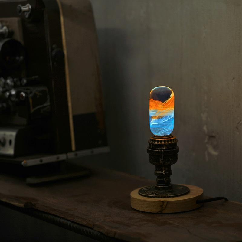 EP LIGHT - Sunrise handcrafted LED bulb with unique resin design, showcasing vibrant colors and intricate paint curves.