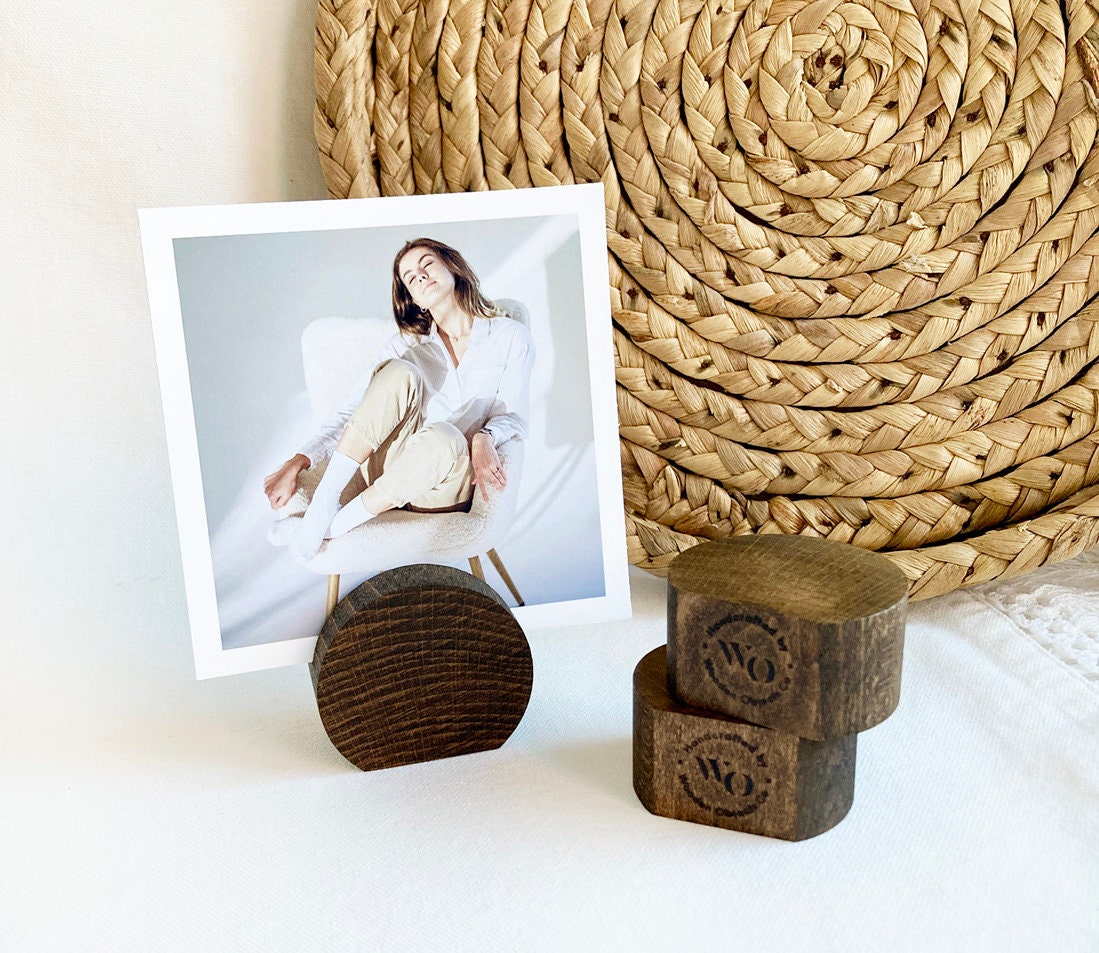 Espresso Moon Card Holder made of eco-friendly wood, displaying various photos and cards elegantly on a desk.