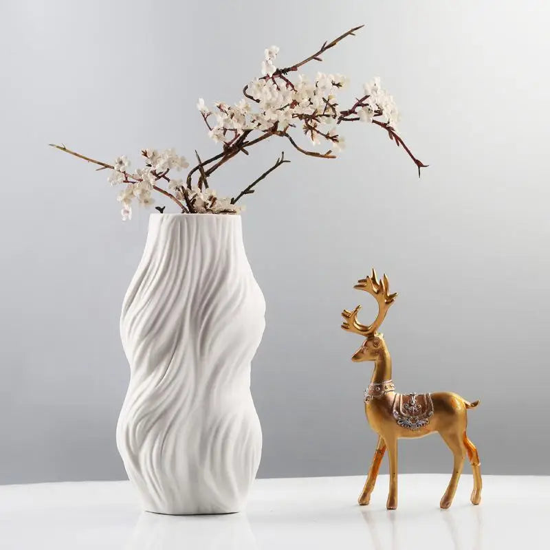 Ethereal Wave Vase in white ceramic with a unique wave design, showcasing its tall and elegant silhouette.