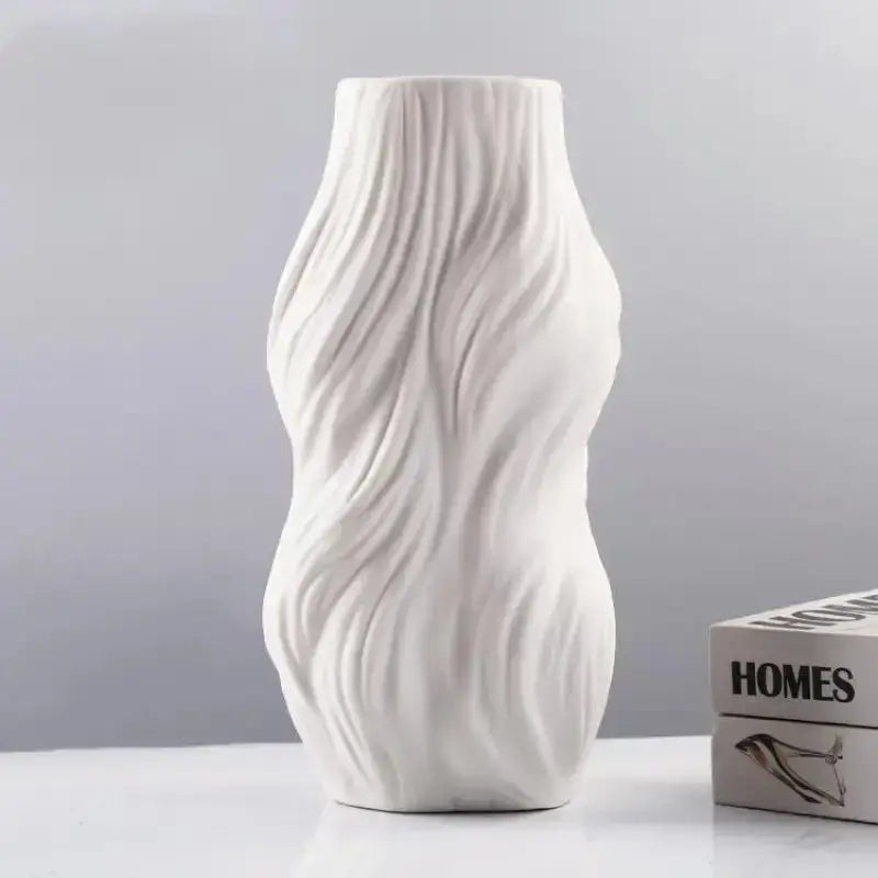 Ethereal Wave Vase in white ceramic with a unique wave design, showcasing its tall and elegant silhouette.