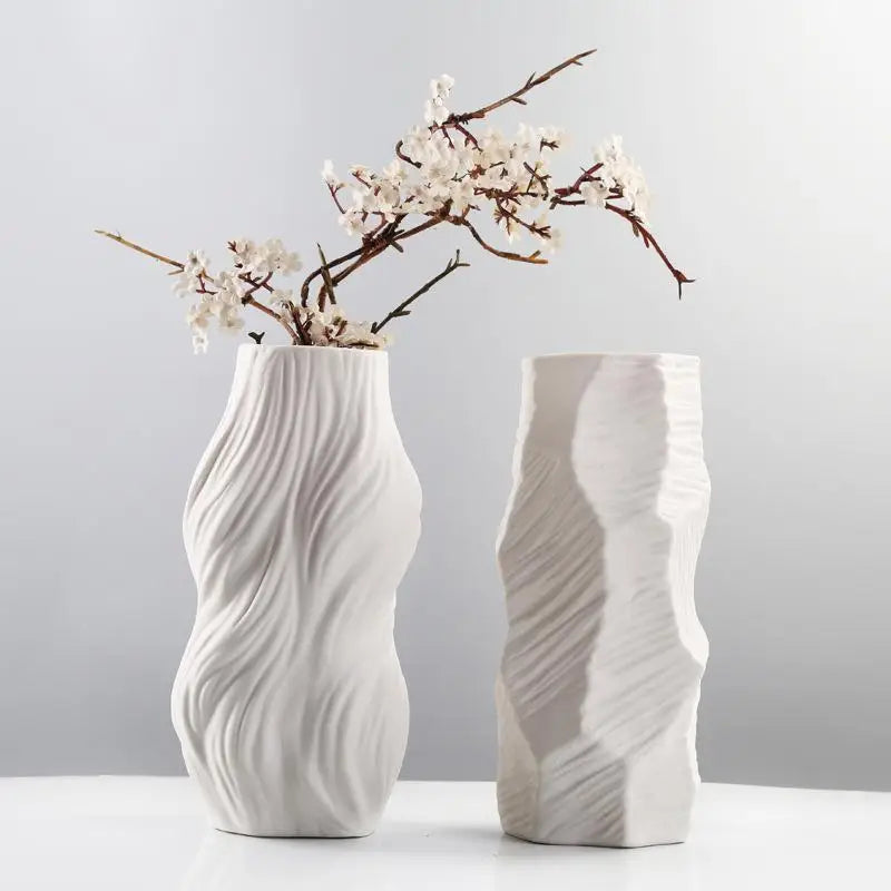 Ethereal Wave Vase in white ceramic with a unique wave design, showcasing its tall and elegant silhouette.