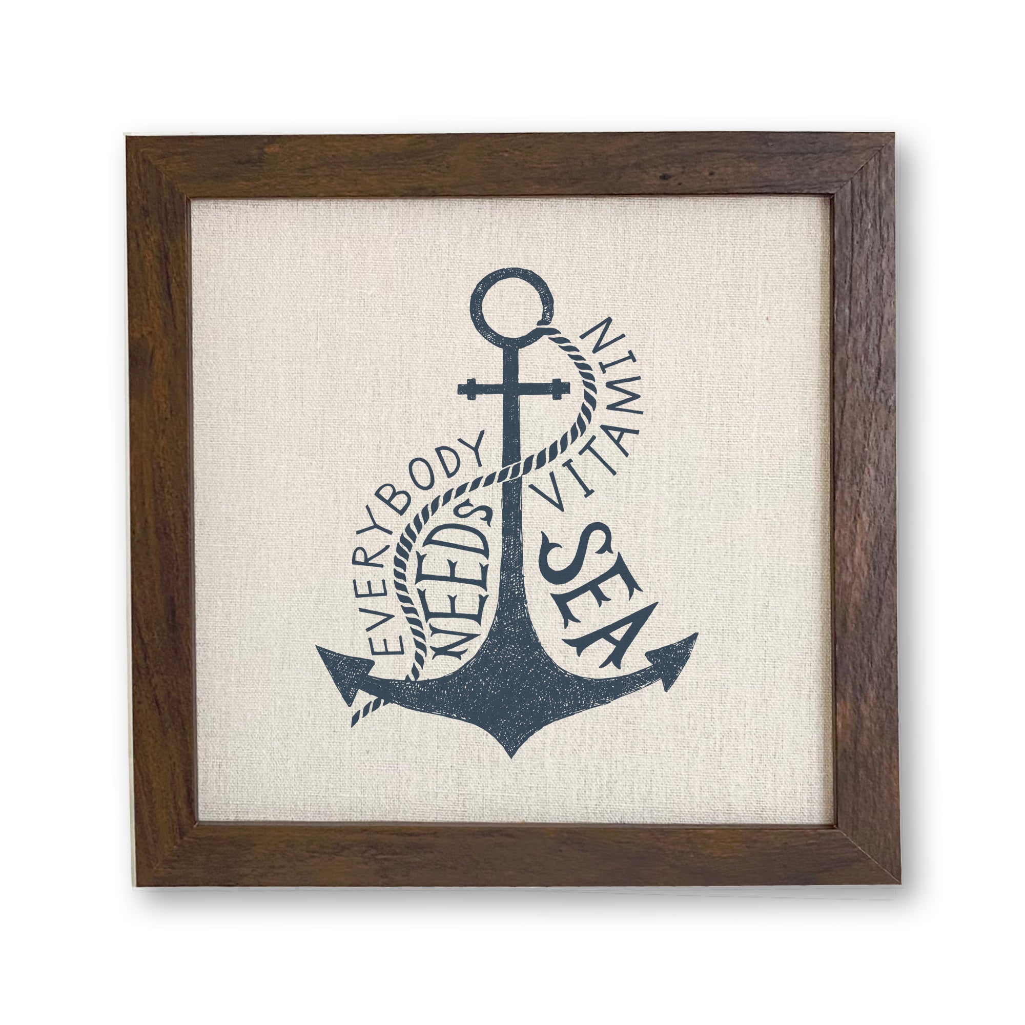 Framed sign reading 'Everyone Needs Vitamin Sea' with a stylish wood frame and linen-look background, perfect for home decor.