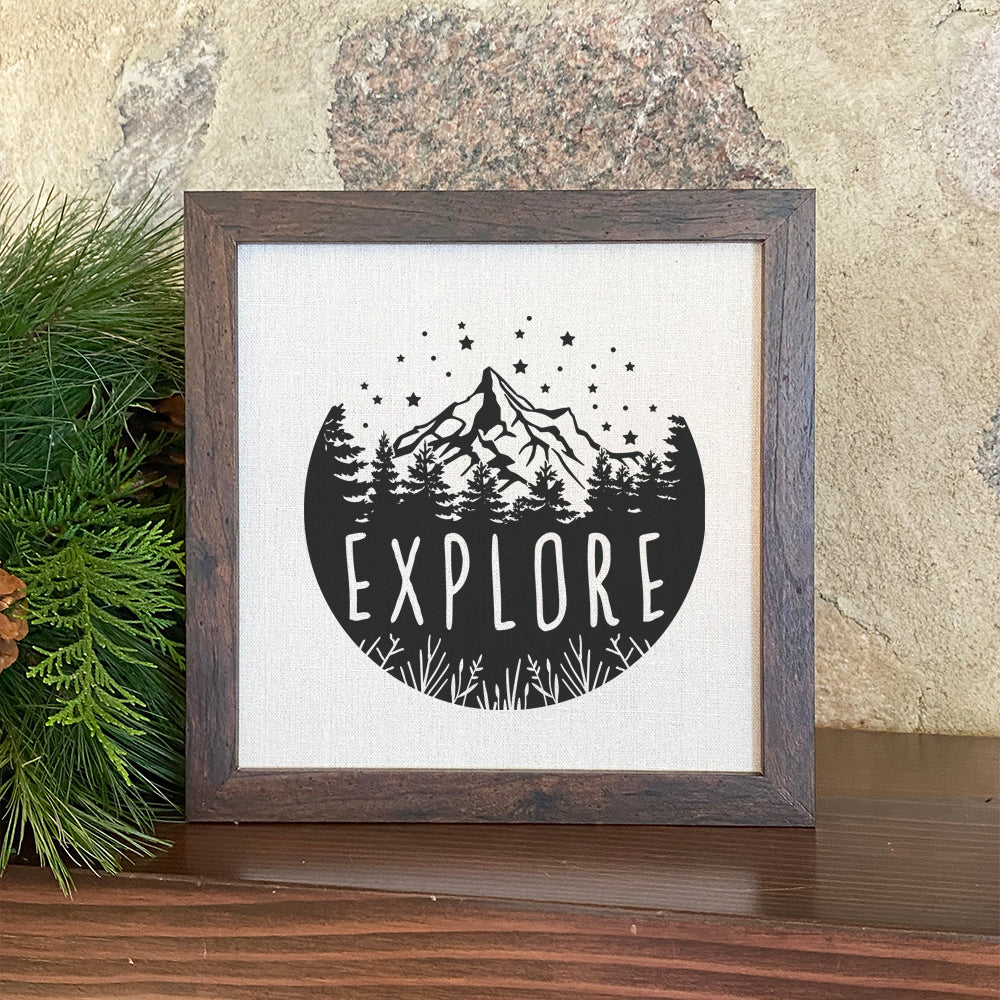 Explore Framed Sign with a stylish wood frame and linen-look background, perfect for shelf or wall display.