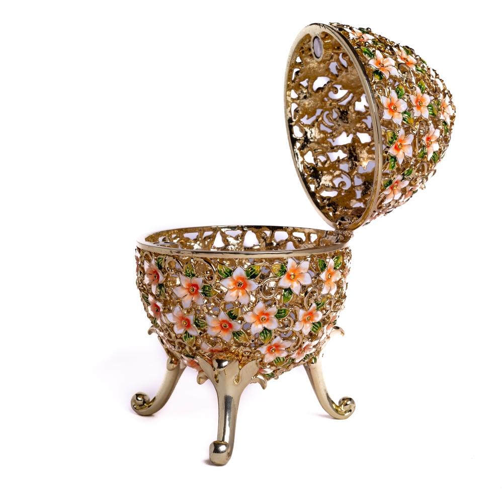 A beautifully crafted Faberge Egg trinket box decorated with vibrant flowers and Austrian crystals, showcasing 24K gold or 925 silver plating.