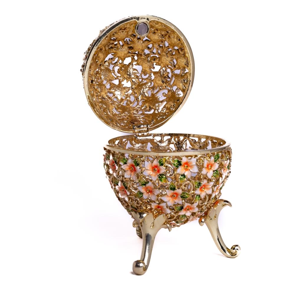 A beautifully crafted Faberge Egg trinket box decorated with vibrant flowers and Austrian crystals, showcasing 24K gold or 925 silver plating.