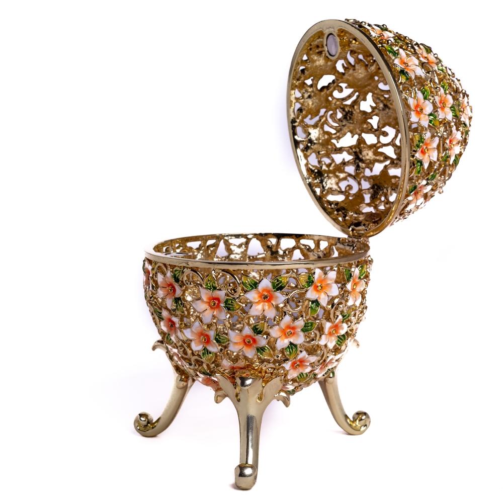 A beautifully crafted Faberge Egg trinket box decorated with vibrant flowers and Austrian crystals, showcasing 24K gold or 925 silver plating.