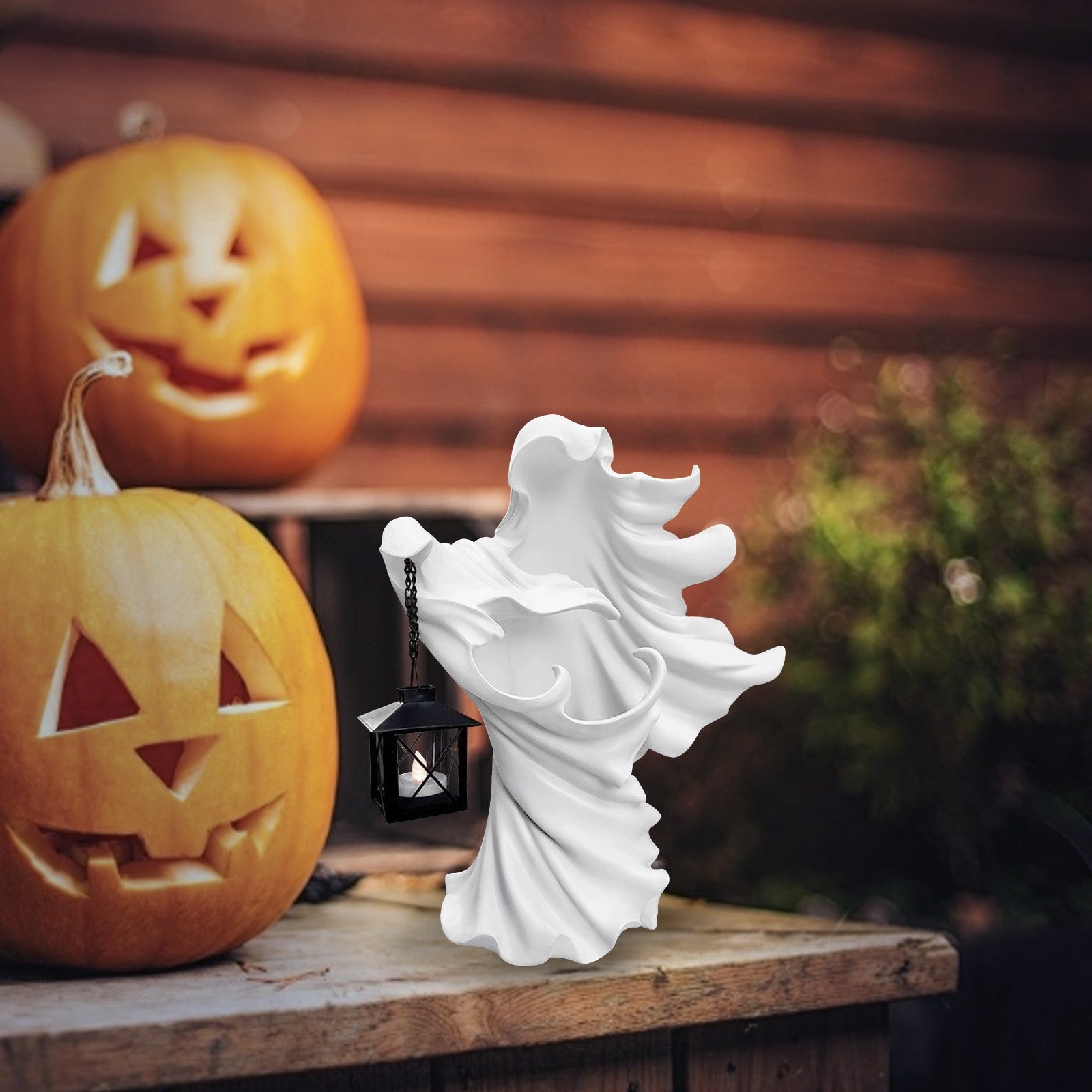 Faceless Ghost Sculpture made of resin, featuring a hand-carved design with a lantern, perfect for Halloween decoration.