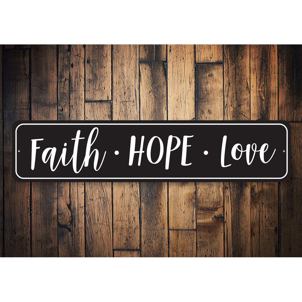 A decorative Faith Hope Love Sign made of high-quality aluminum, featuring elegant lettering and a stylish design, perfect for home decor.