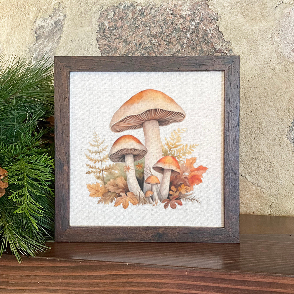 A beautifully framed sign featuring fall forest mushrooms, set in a walnut veneer frame with a linen-look background.