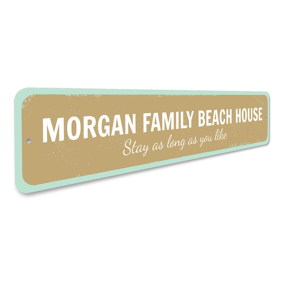 A customizable Family Beach House Sign made of durable aluminum, featuring a coastal design perfect for beach houses and seaside decor.