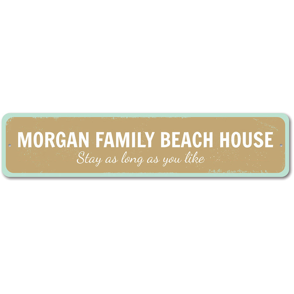 A customizable Family Beach House Sign made of durable aluminum, featuring a coastal design perfect for beach houses and seaside decor.