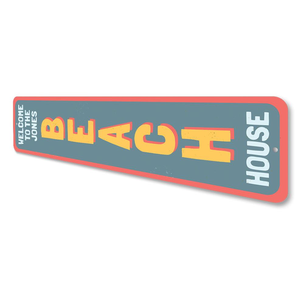 Family Beach House Welcome Vertical Sign made of aluminum, featuring a welcoming design perfect for beach-themed decor.