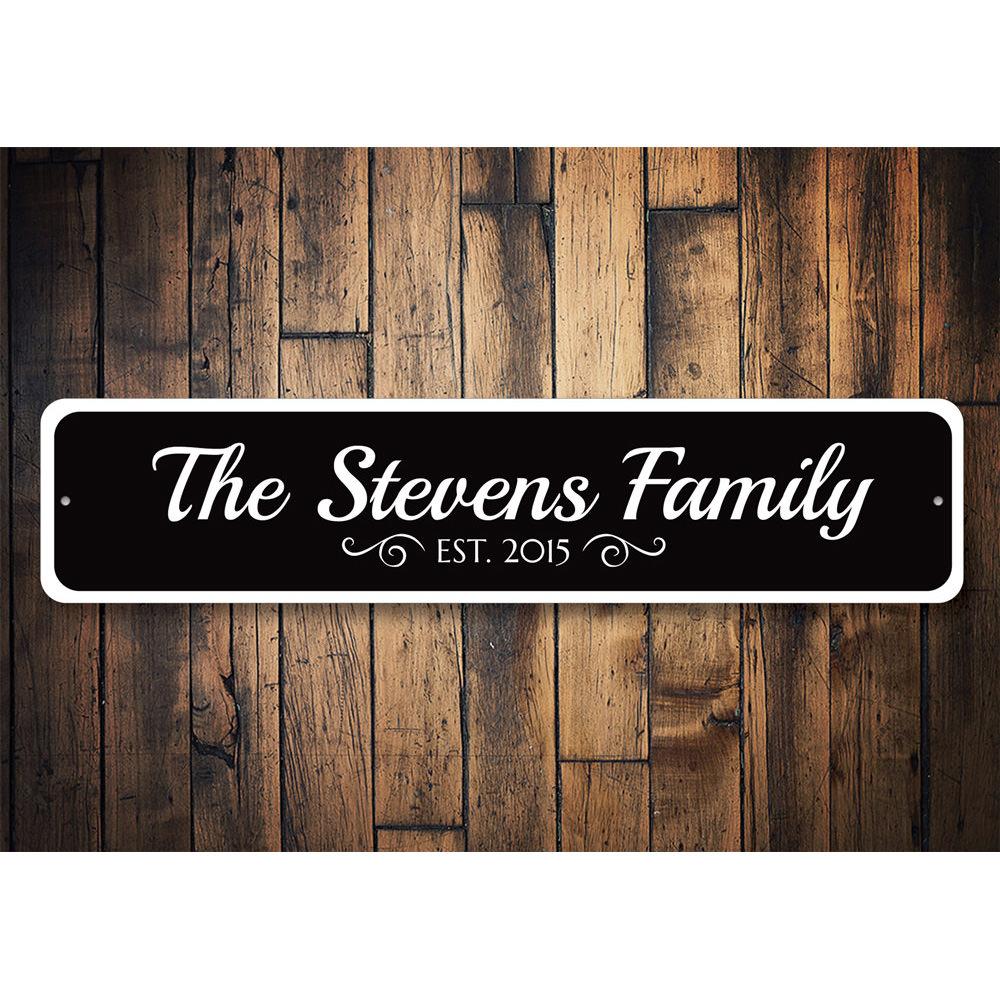 A personalized Family Est. Date Sign made of high-quality aluminum, featuring custom text and a decorative design, suitable for home decor.