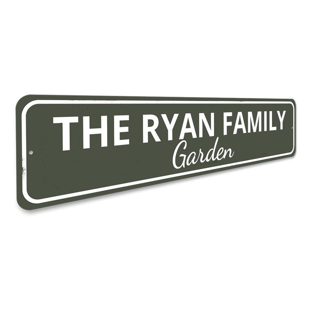 A beautifully crafted Family Garden Sign made of durable aluminum, featuring customizable text for personalization, displayed in a lush garden setting.