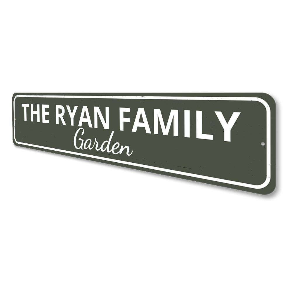 A beautifully crafted Family Garden Sign made of durable aluminum, featuring customizable text for personalization, displayed in a lush garden setting.