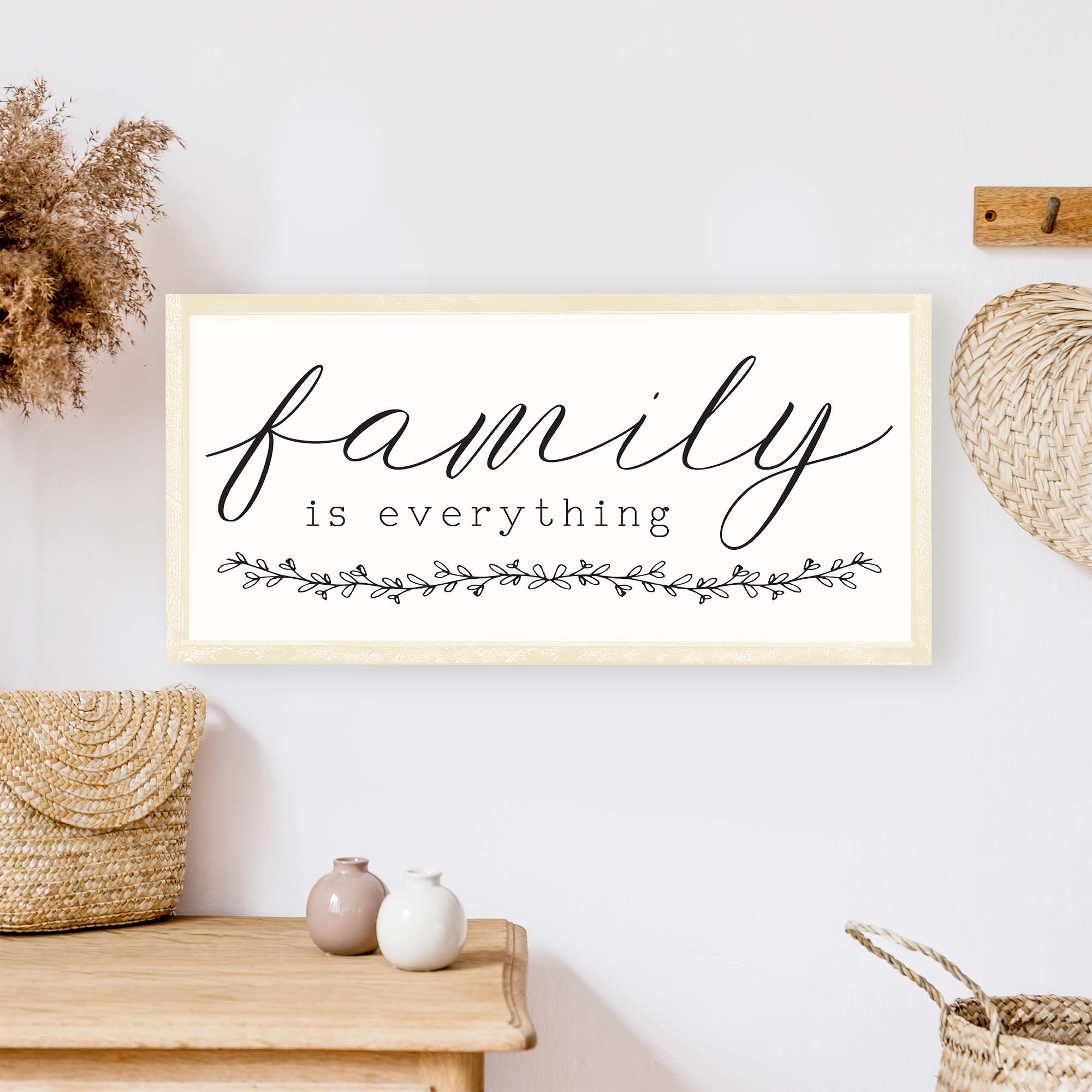 Family Is Everything Wood Sign featuring a wreath design, available in black or white, perfect for home decor.