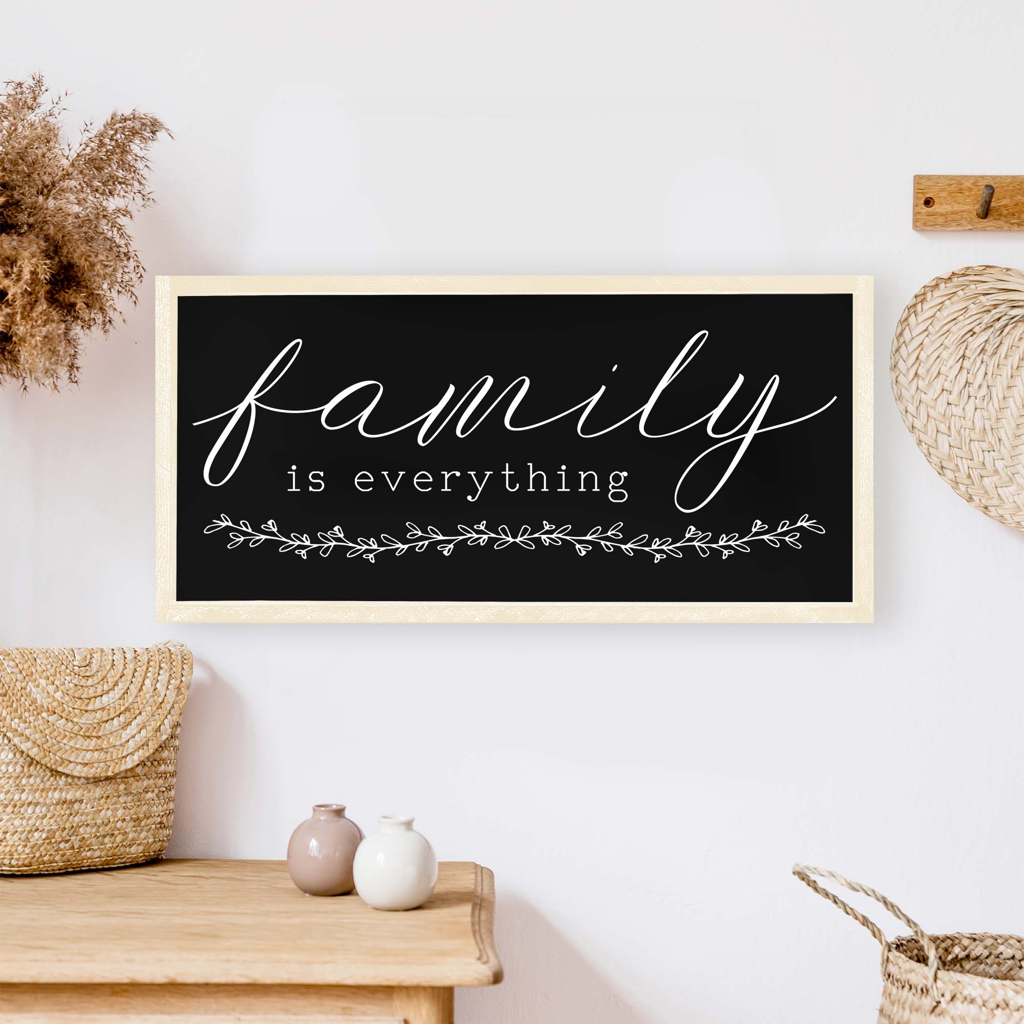 Family Is Everything Wood Sign featuring a wreath design, available in black or white, perfect for home decor.