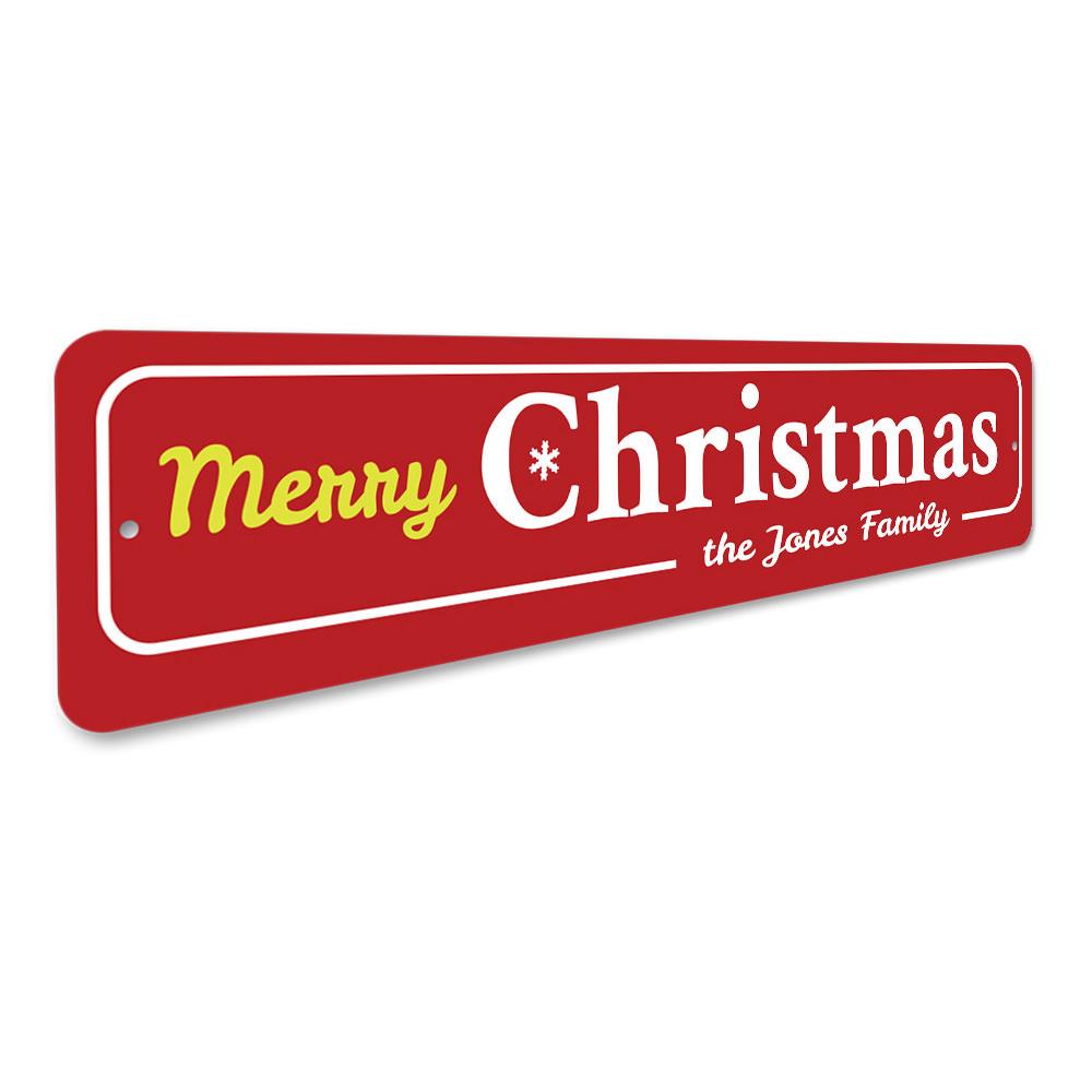 A decorative Family Merry Christmas Snowflake Sign featuring a festive snowflake design, perfect for holiday decor.