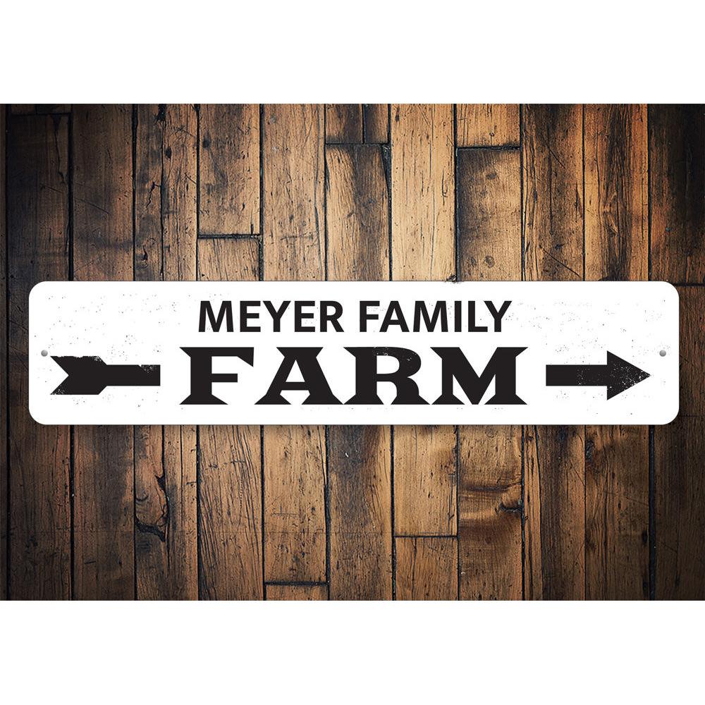 A decorative Family Name Farm Arrow Sign made of high-quality aluminum, featuring customizable text and a rustic design, perfect for home decor.