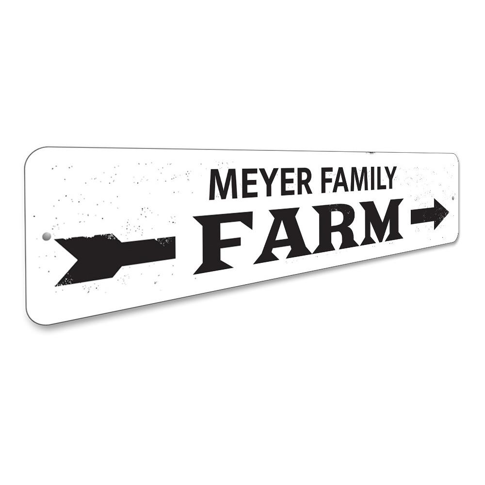 A decorative Family Name Farm Arrow Sign made of high-quality aluminum, featuring customizable text and a rustic design, perfect for home decor.