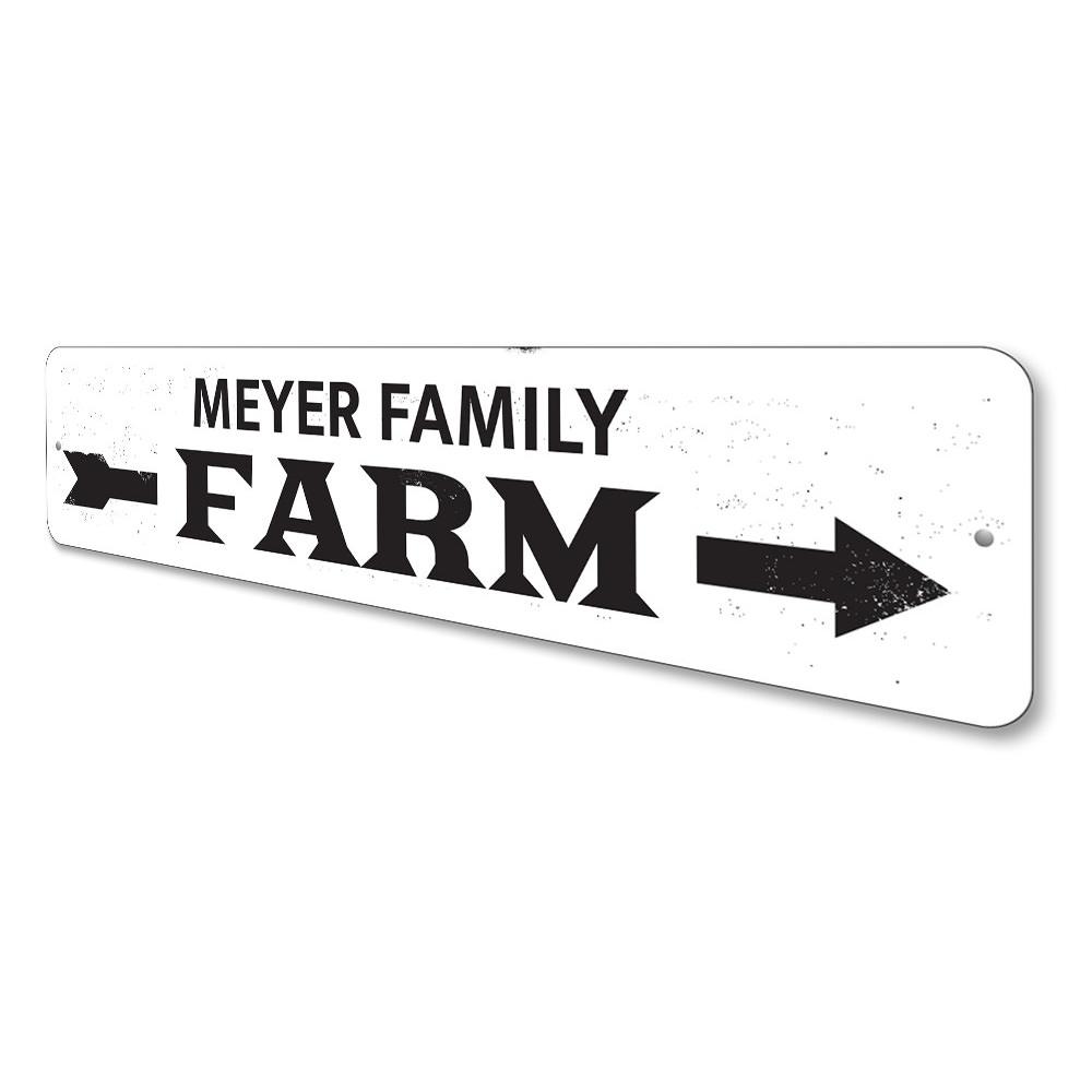 A decorative Family Name Farm Arrow Sign made of high-quality aluminum, featuring customizable text and a rustic design, perfect for home decor.