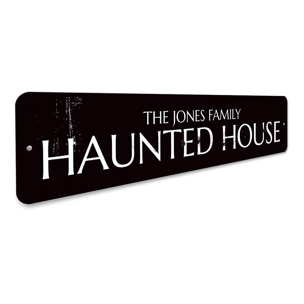 A personalized Family Name Haunted House Sign made of high-quality aluminum, featuring spooky design elements perfect for Halloween decor.