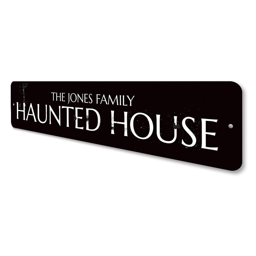 A personalized Family Name Haunted House Sign made of high-quality aluminum, featuring spooky design elements perfect for Halloween decor.