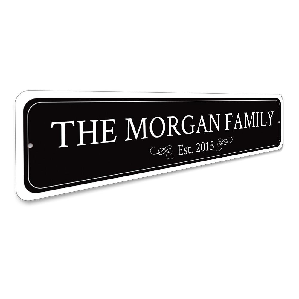 A personalized Family Name Sign made of high-quality aluminum, featuring custom text and pre-drilled holes for easy mounting.