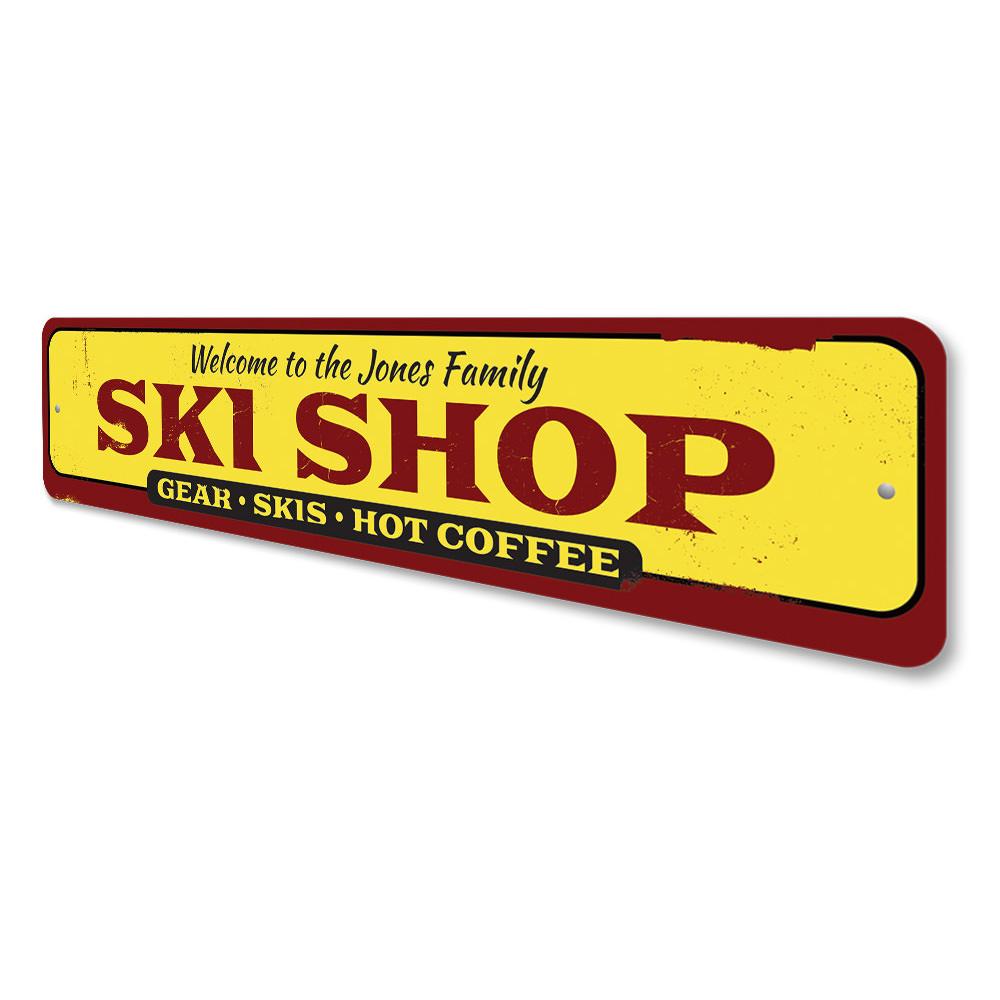 A decorative Family Ski Shop Sign made of high-quality aluminum, featuring customizable text and pre-drilled holes for easy mounting.