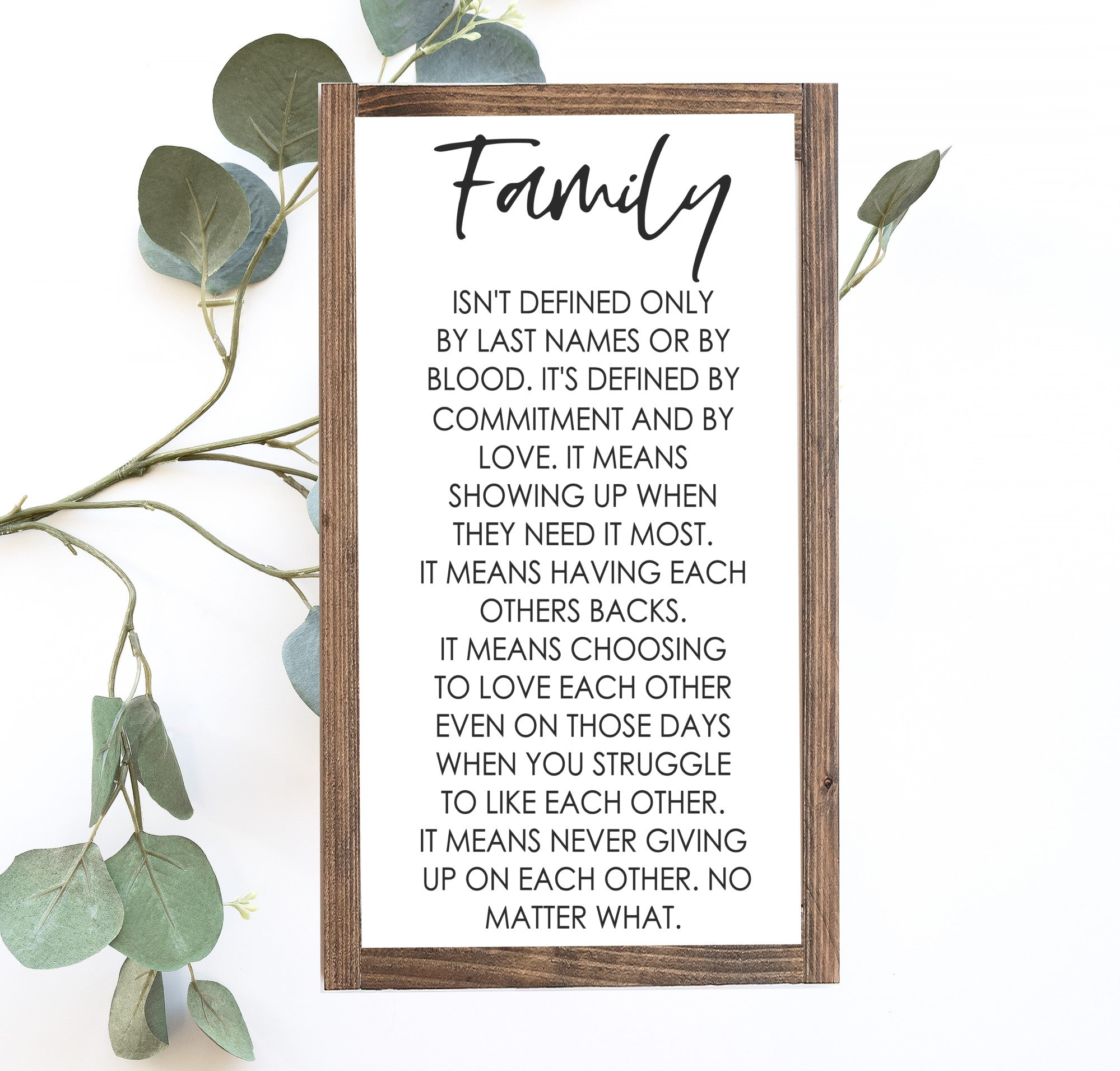 Handcrafted Family Wood Sign with matte white background and painted lettering, showcasing unique wood grain and knots.