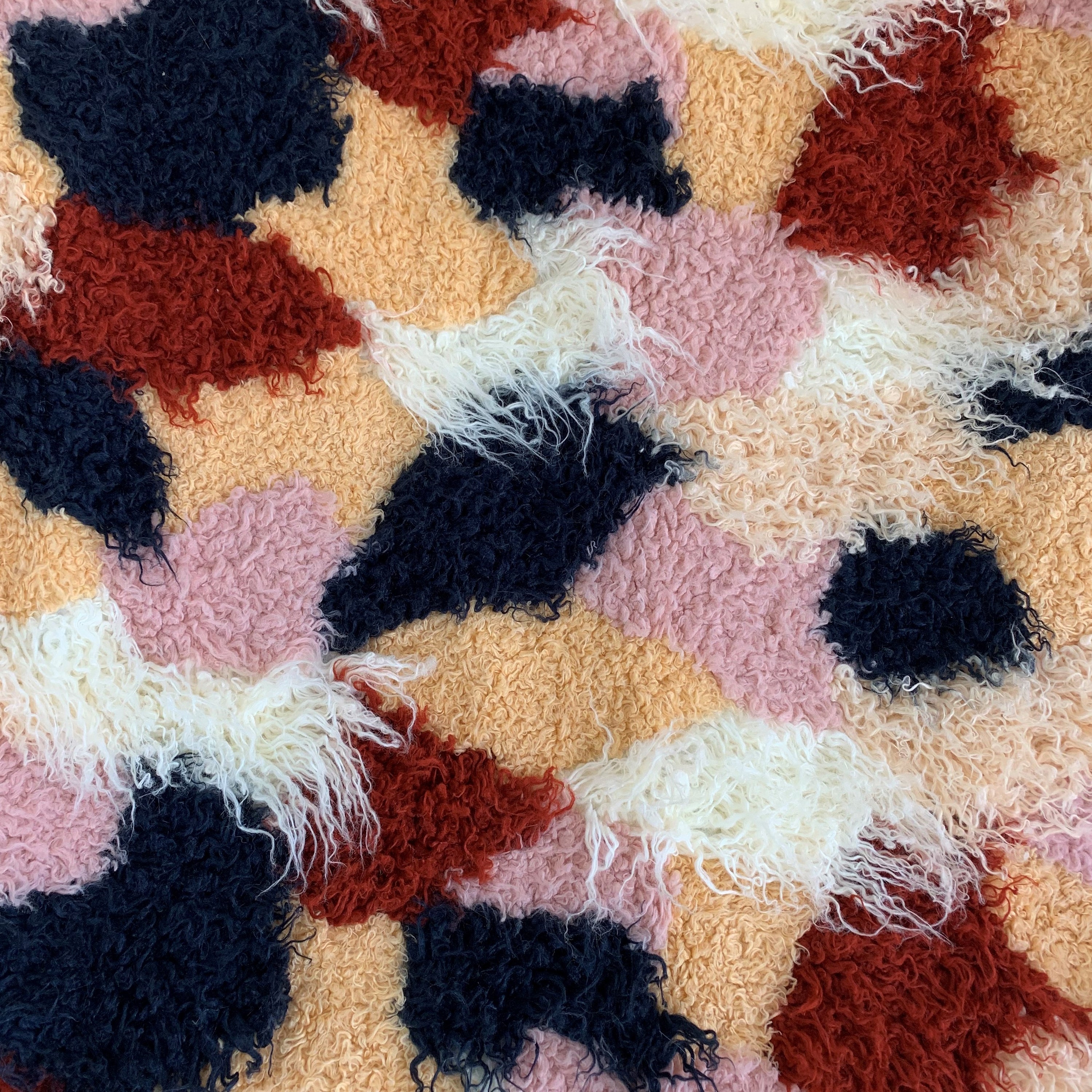 Fanciful Boho Plush Handmade Luxury Faux Fur Throw in vibrant red, white, and blue colors, showcasing its plush texture and reversible design.