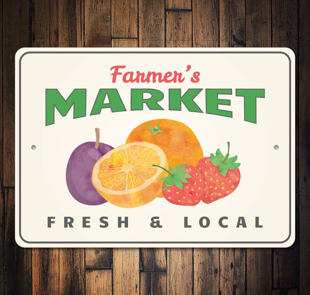 A decorative Farmer's Market Fruit Sign made of aluminum, featuring vibrant fruit graphics, perfect for home decor.