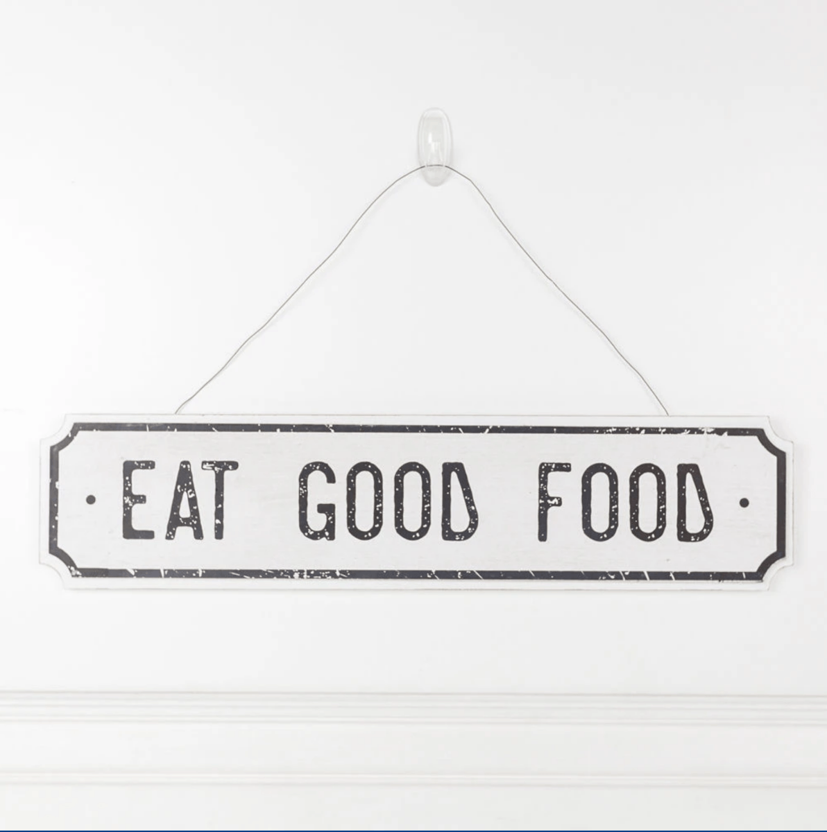 Farmhouse Chic hanging wood sign with 'Bless This Home' and 'Eat Good Food' messages, featuring a rustic white and black design.