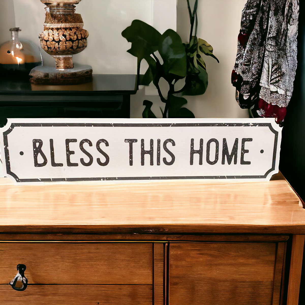 Farmhouse Chic hanging wood sign with 'Bless This Home' and 'Eat Good Food' messages, featuring a rustic white and black design.