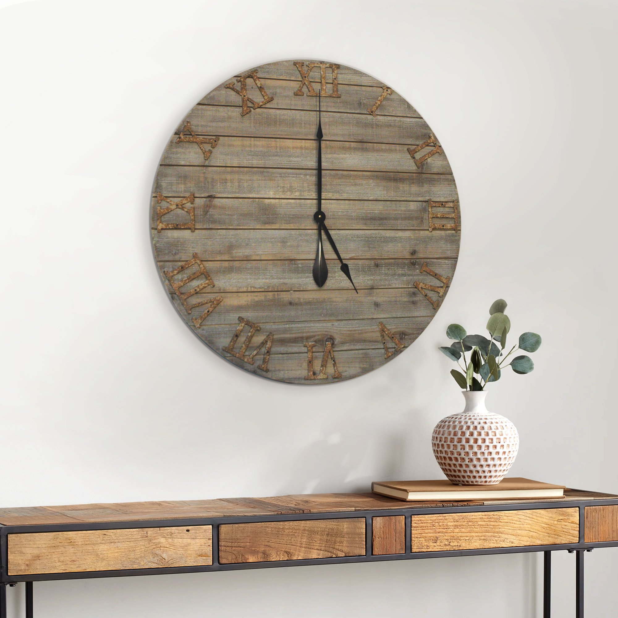 A 30-inch oversized farmhouse wall clock made of real wood with cast iron numbers, showcasing a beautifully distressed finish.